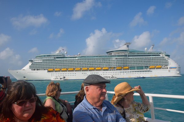 Royal Caribbean's Navigator of the Seas and a ferry boat carrying passengers at this tender port on our Caribbean Cruise vacation
